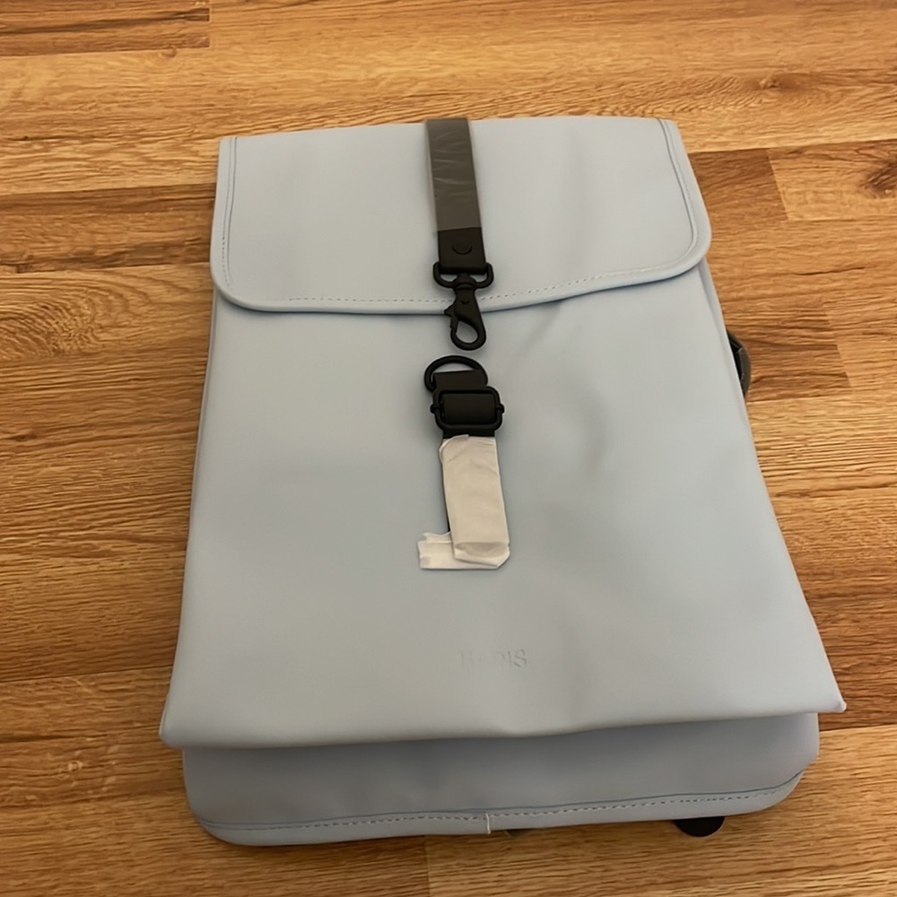 Brand new RAINS Backpack in color Sky